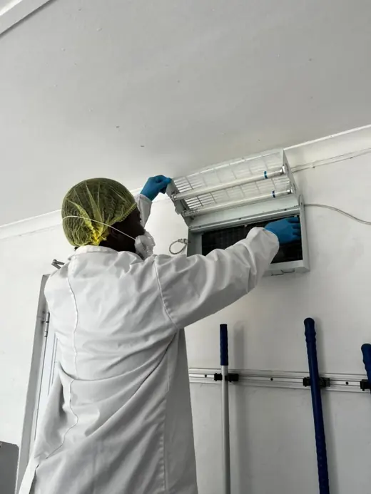 Servicing an insect light trap, ASC Pest Control