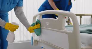 Registered hospital-grade disinfectant products lined up next to safety data sheets on a clinical surface